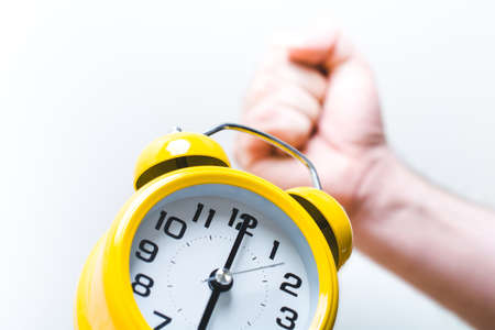 Fist Turning Off Alarm Clock At 6 OClock In The Morningの写真素材
