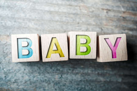 Baby Written On Wooden Blocks On A Boardの写真素材
