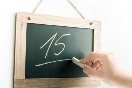 Number 15 Handwritten With Chalk On A Blackboardの写真素材