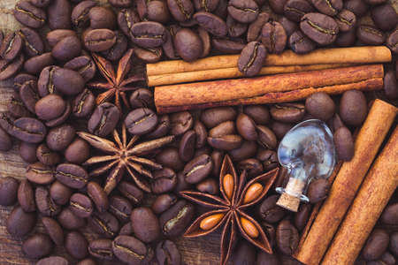 coffee beans, anise and cinnamon on tableの写真素材