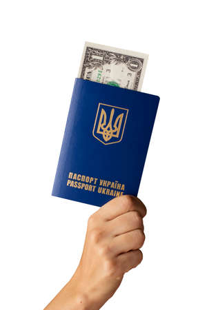 the Ukrainian international passport and money in hand on a white backgroundの写真素材