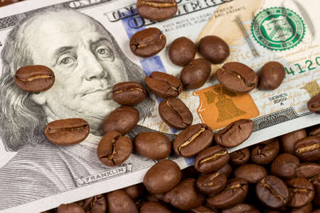 coffee beans and one hundred dollar billの写真素材