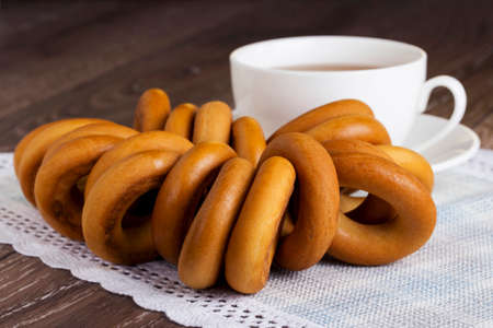 cup of tea and bagels on tableの写真素材