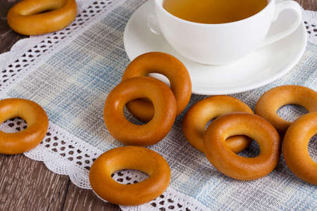 cup of tea and bagels on tableの写真素材