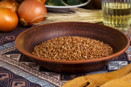 a handful of buckwheat in the plateの写真素材