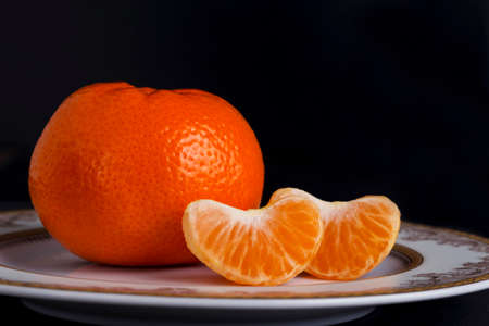 the ripe tangerine on a black backgroundの写真素材