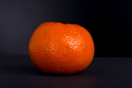 the ripe tangerine on a black backgroundの写真素材