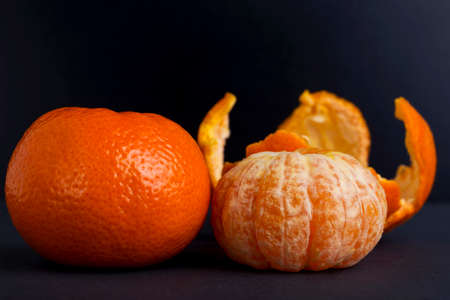 the ripe tangerine on a black backgroundの写真素材