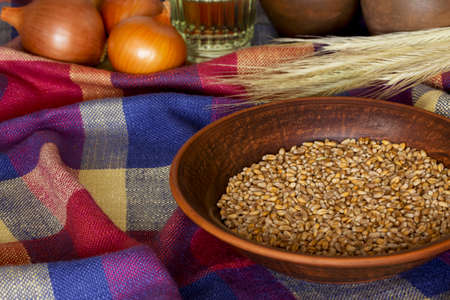 a handful of wheat in the plateの写真素材