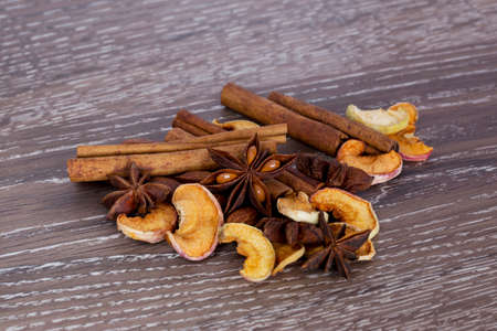 spices and dried fruits on wooden backgroundの写真素材