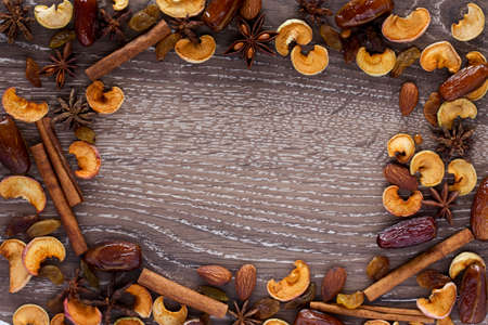 a frame of spices and dried fruitsの写真素材