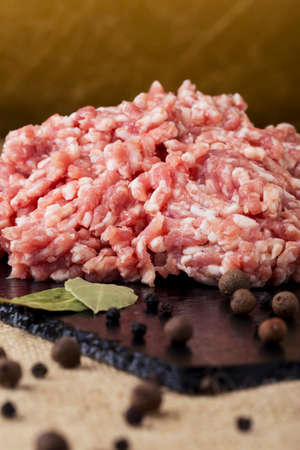 minced meat on a black cutting board