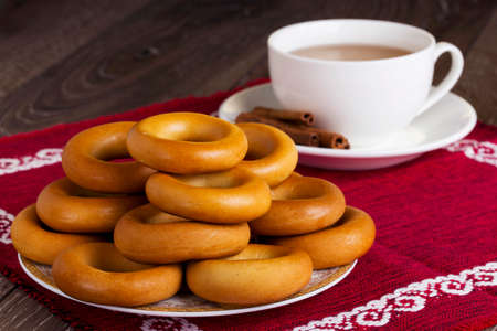 cup of tea and bagels on tableの写真素材