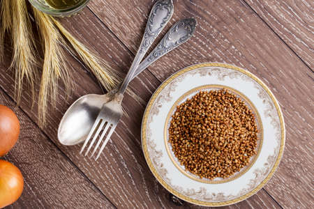 a handful of buckwheat in the plateの写真素材