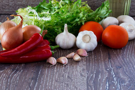 the different vegetables on a wooden backgroundの写真素材