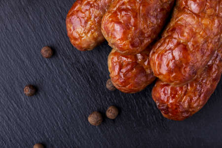 the fried sausage on a black backgroundの写真素材