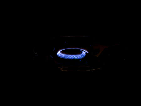 gas burner is lit in the dark