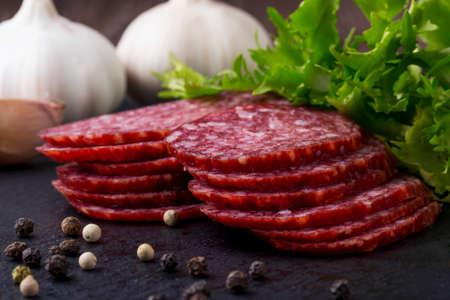 sausage and vegetables on a cutting boardの写真素材