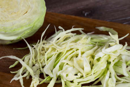 the fresh cabbage is cut into stripsの写真素材