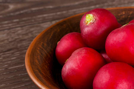 the red radishes on a wooden tableの写真素材