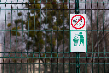 signs smoking is prohibited hanging on the fenceの写真素材