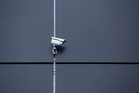 the surveillance camera on a building wall