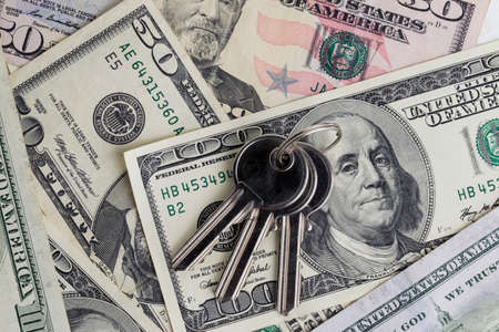 the apartment keys on a money background