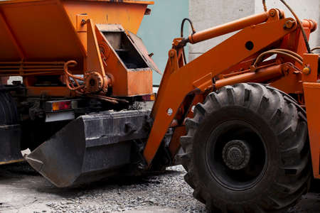 asphalt is loaded into the bucket excavatorの写真素材