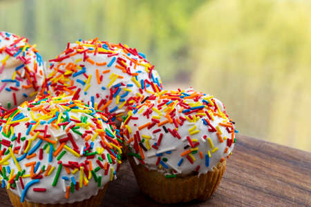 the sweet muffin on a wooden boardの写真素材