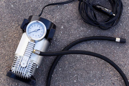 the pump to inflate automobile wheels  lying on the floor