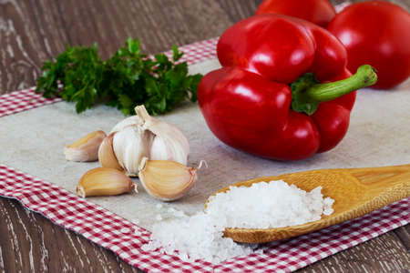 head of garlic and sea salt on the tableの写真素材