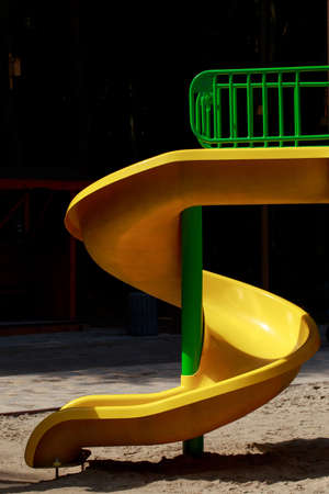 the yellow children's slides on a playground