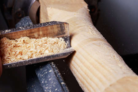 the piece of wood is making on a lathe