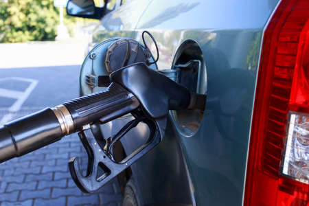 car fill with gasoline at a gas station