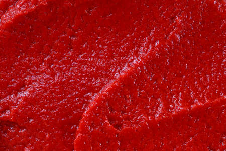 the background of a red tomato sauce