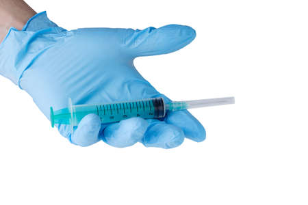 medical syringe in hand on white backgroundの写真素材