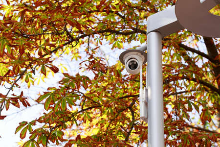 the surveillance camera on a lamp post