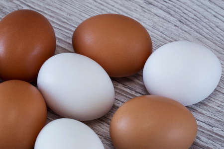A lot of eggs on a wooden backgroundの写真素材