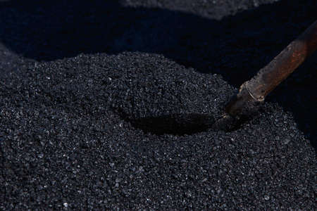 Laying hot new asphalt in the city
