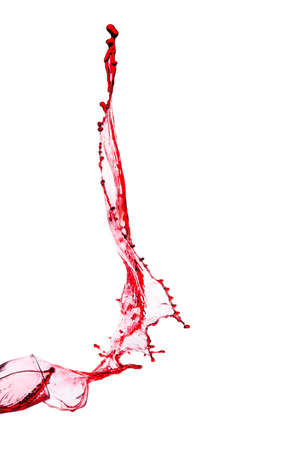splash of red wine from goblet on a white backgroundの写真素材