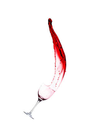 splash of red wine from goblet on a white backgroundの写真素材
