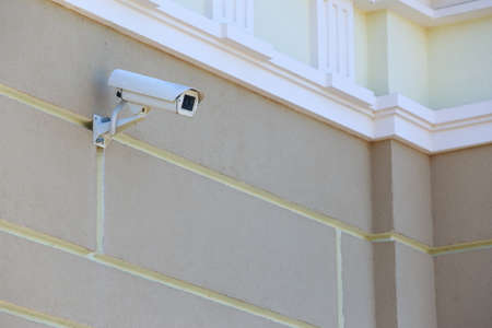 the surveillance camera on a wall of building