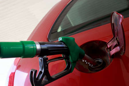 car fill with gasoline at a gas stationの写真素材