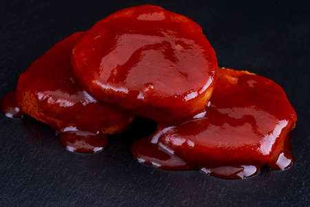 pieces of baked meat on a black tableの写真素材