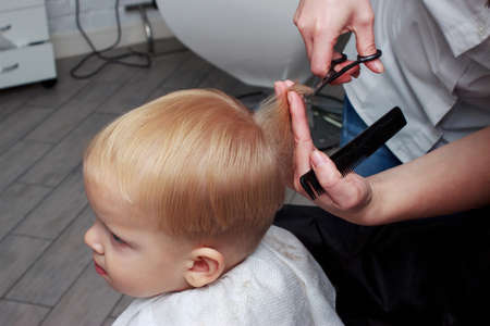 the little boy in a hairdressing salonの写真素材