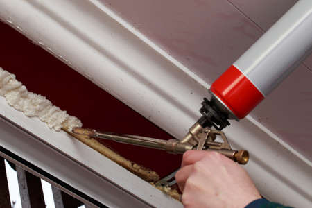 Using polyurethane foam in the installation of windowsの写真素材