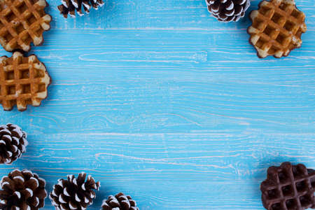 delicious Belgian waffles with chocolate on a wooden tableの写真素材