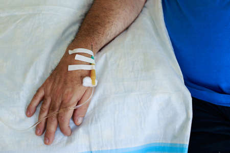 The hand with needle of medical dropperの写真素材