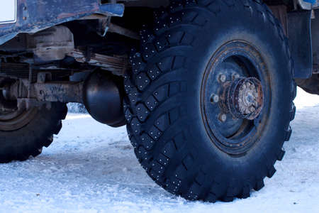Machine with studded tires on the snow