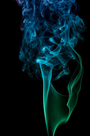 wavy blue smoke on a black backgroundの写真素材